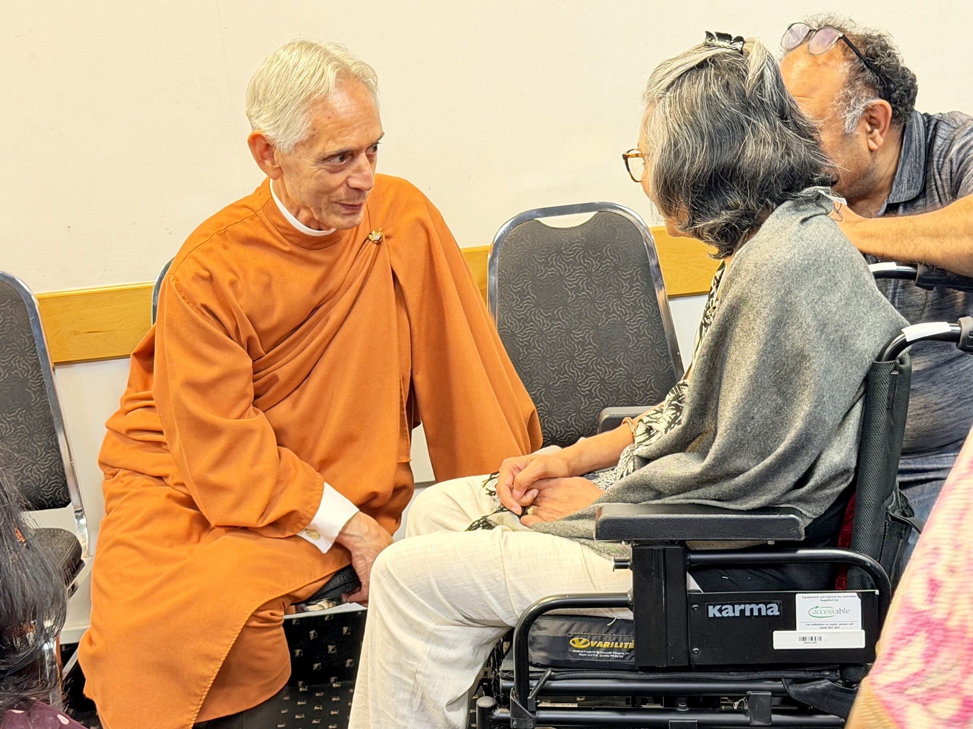 ....and Brother Sevananda greets a devotee.