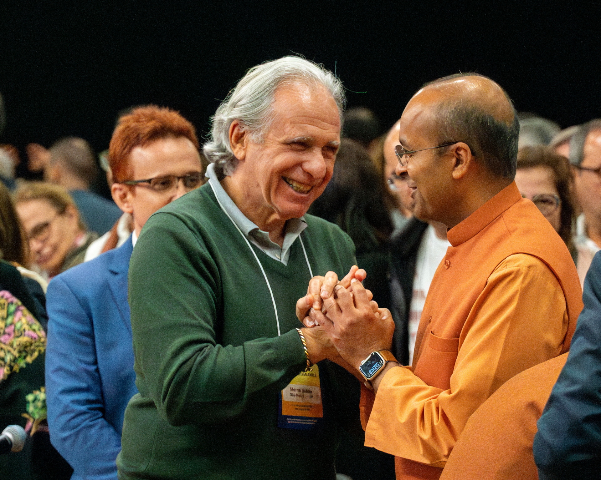 Brother Kamalananda greets a longtime member.