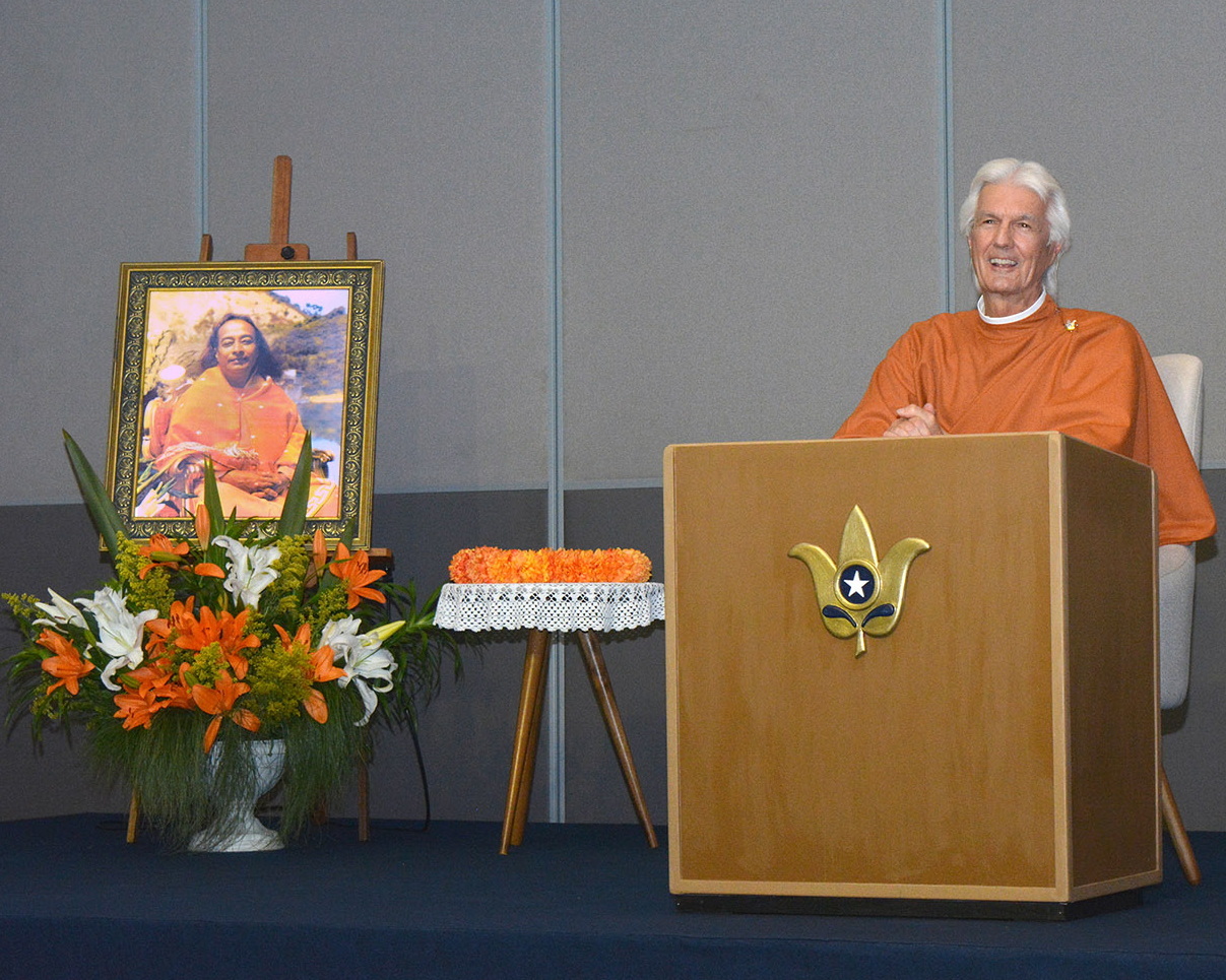 Brother Chidananda welcomes the participants, many coming from long distances to attend.
