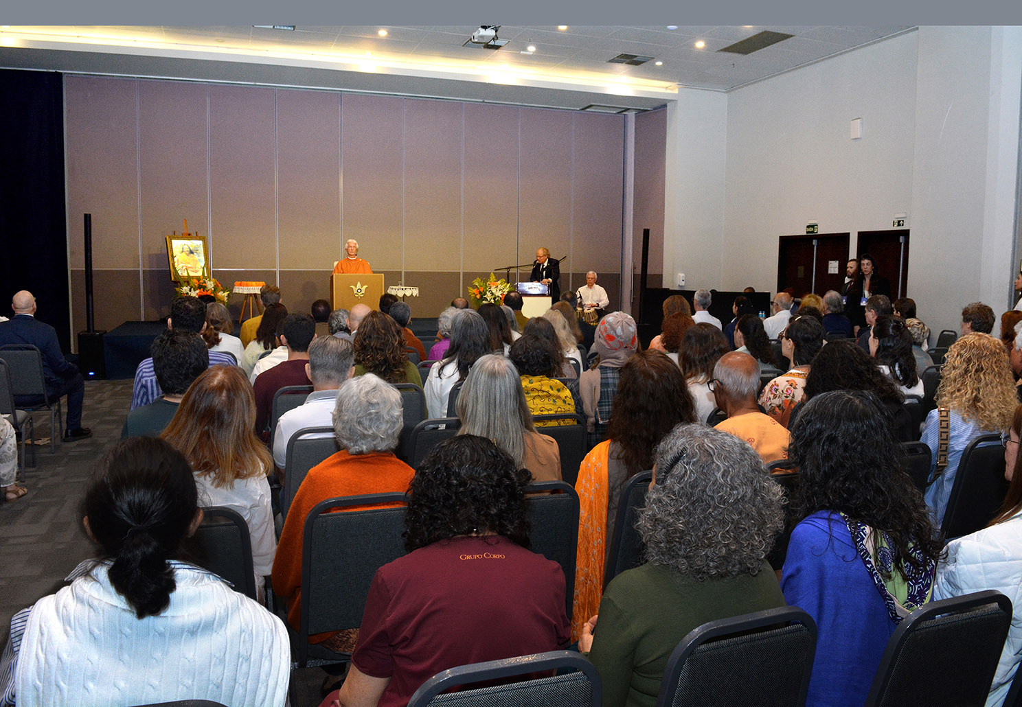 The hall is filled with silence as Brother Chidananda conducts a meditation.