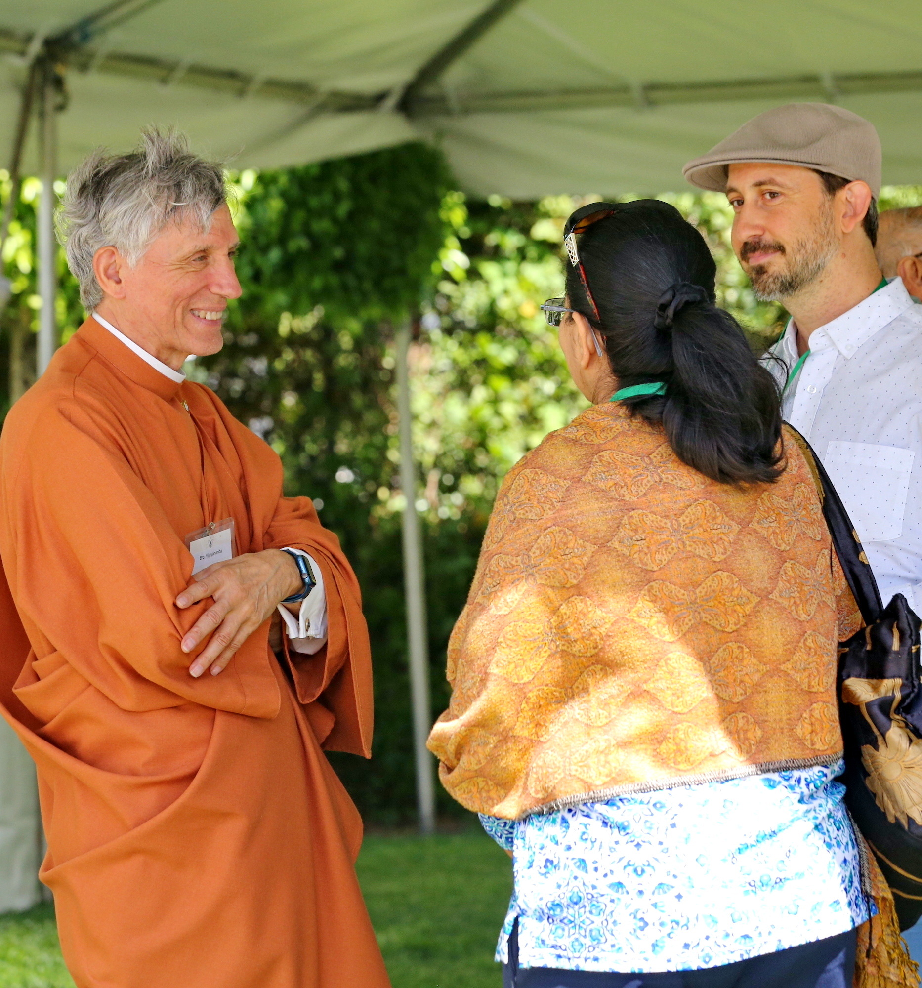 Brother Vijayananda talks with members.