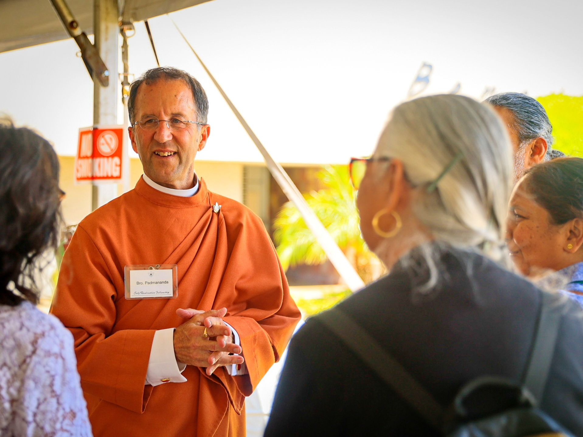 Brother Padmananda converses with attendees.