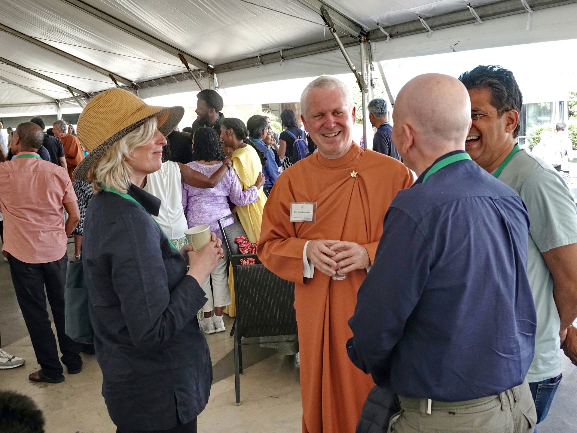 Brother Kartikananda greets devotees attending Convocation.