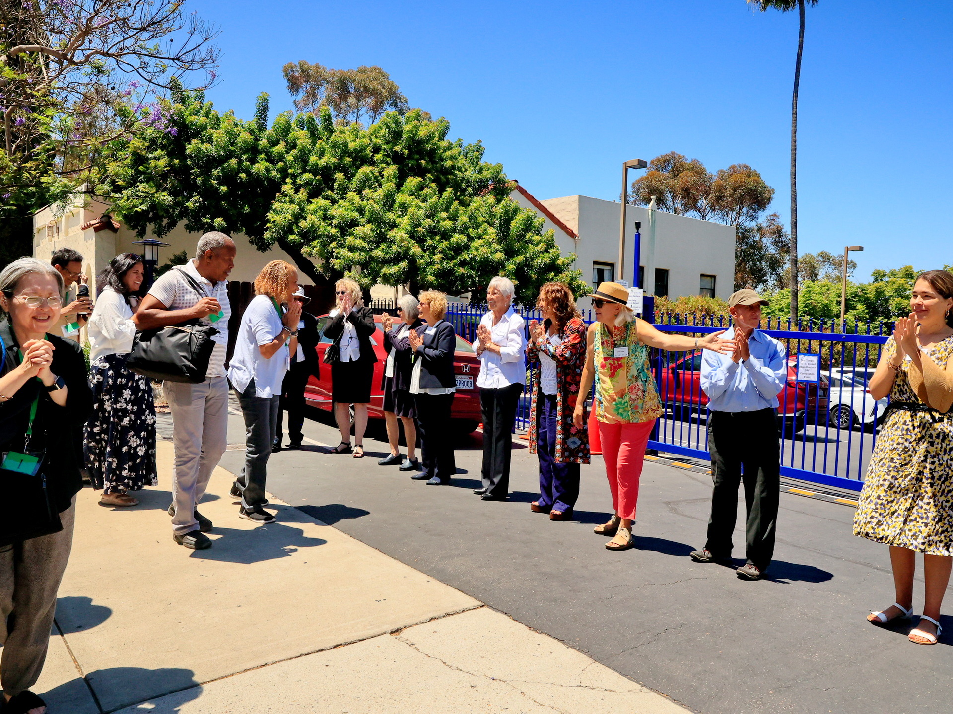 San Diego Temple volunteers greet the bus loads of arriving devotees.