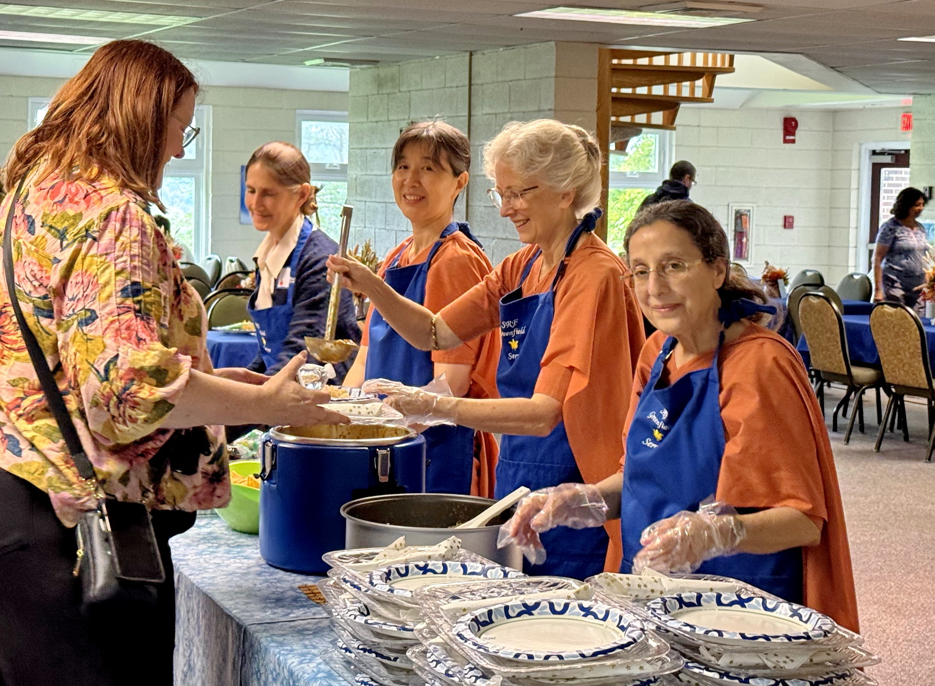 Nuns from the Greenfield Retreat serve participants during meals.