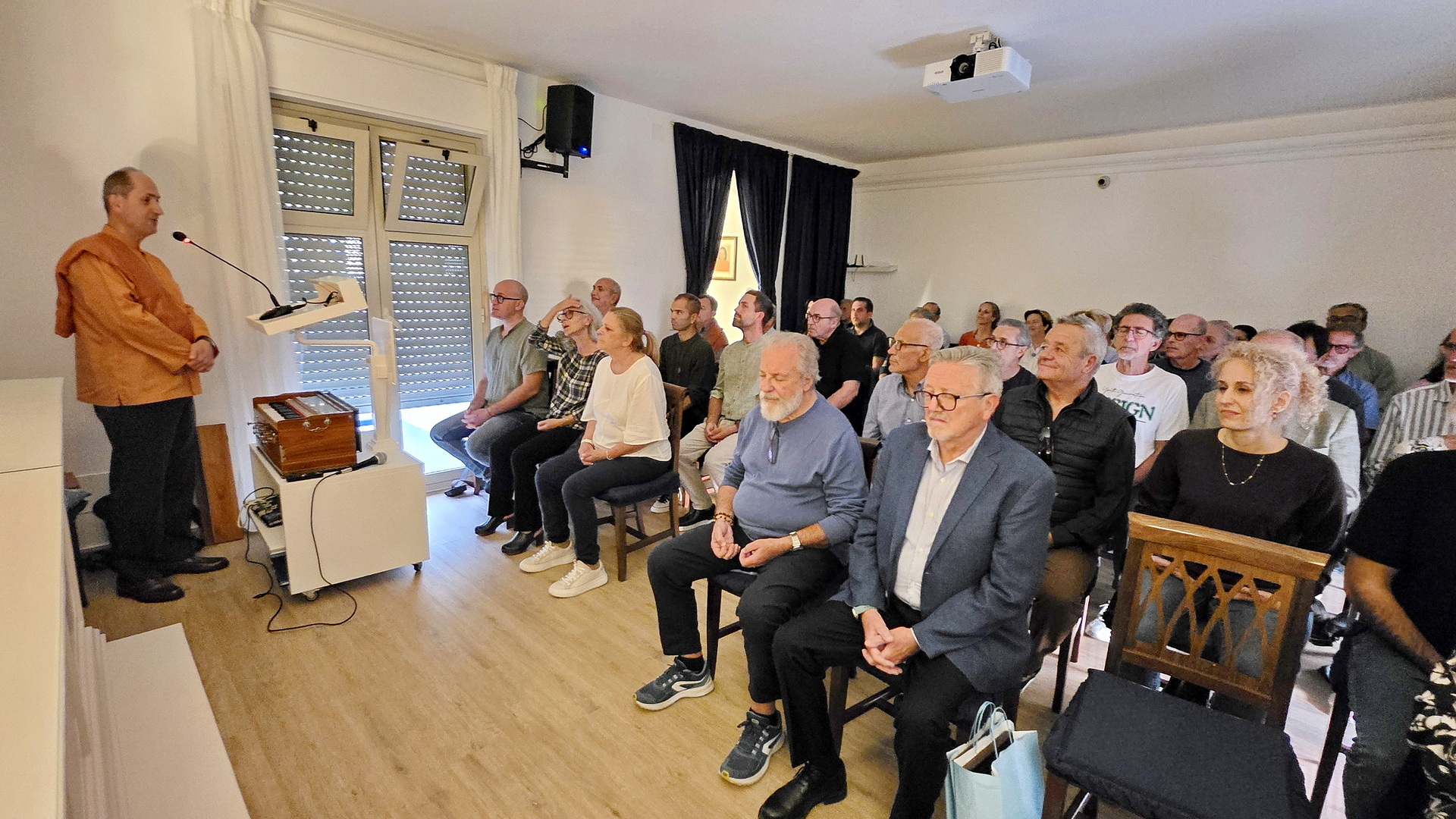 ....where Brother Tyagananda is shown giving a class in Italian on Paramahansaji's how-to-live teachings.