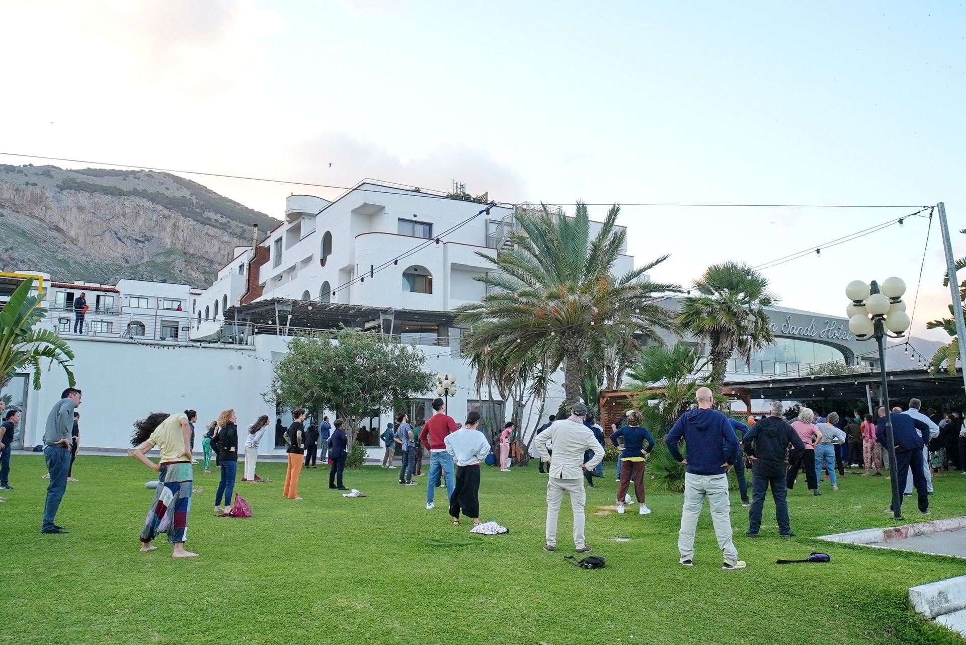 Participants practice Paramahansaji's Energization Exercises before a group meditation.
