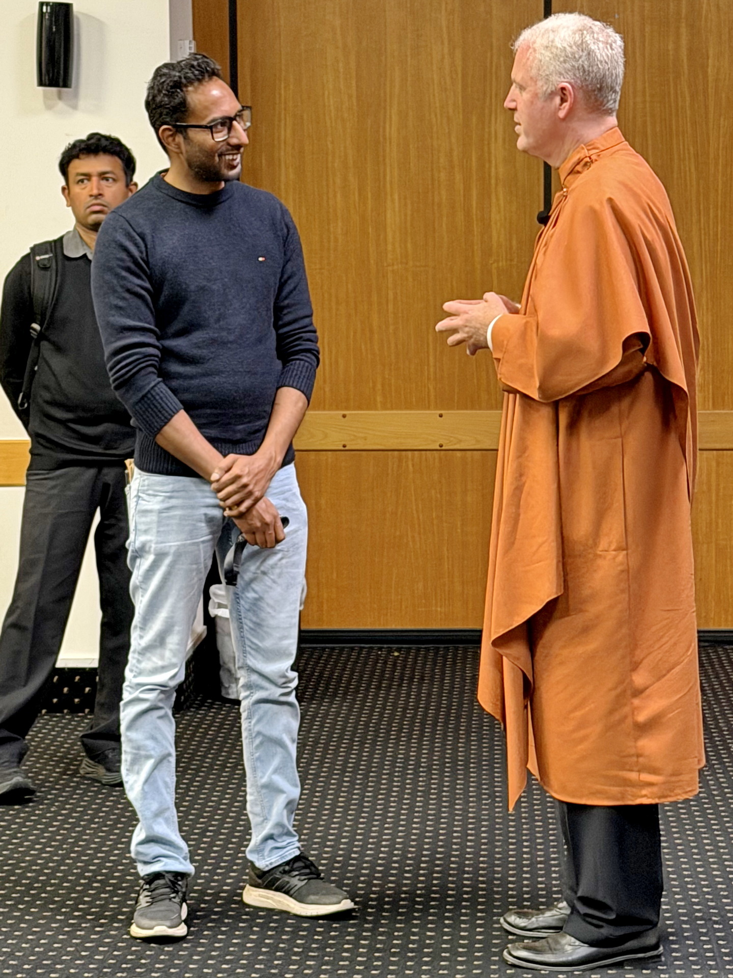 Brother Kartikananda greets members after a class....