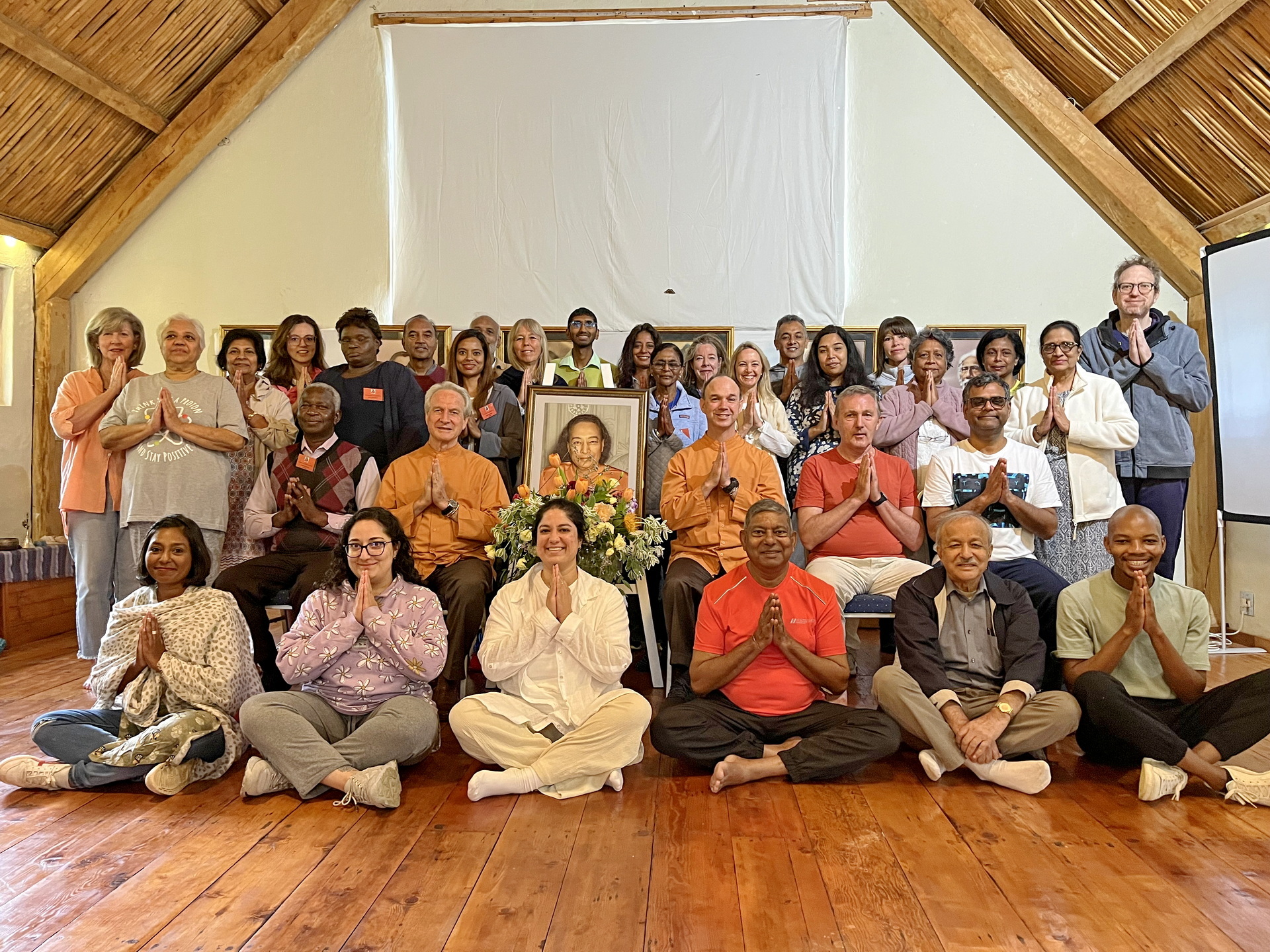 In March, Brother Bhimananda and Brother Nikhilananda visited members in South Africa and Europe, and are shown here with the SRF meditation group in Johannesburg, South Africa.