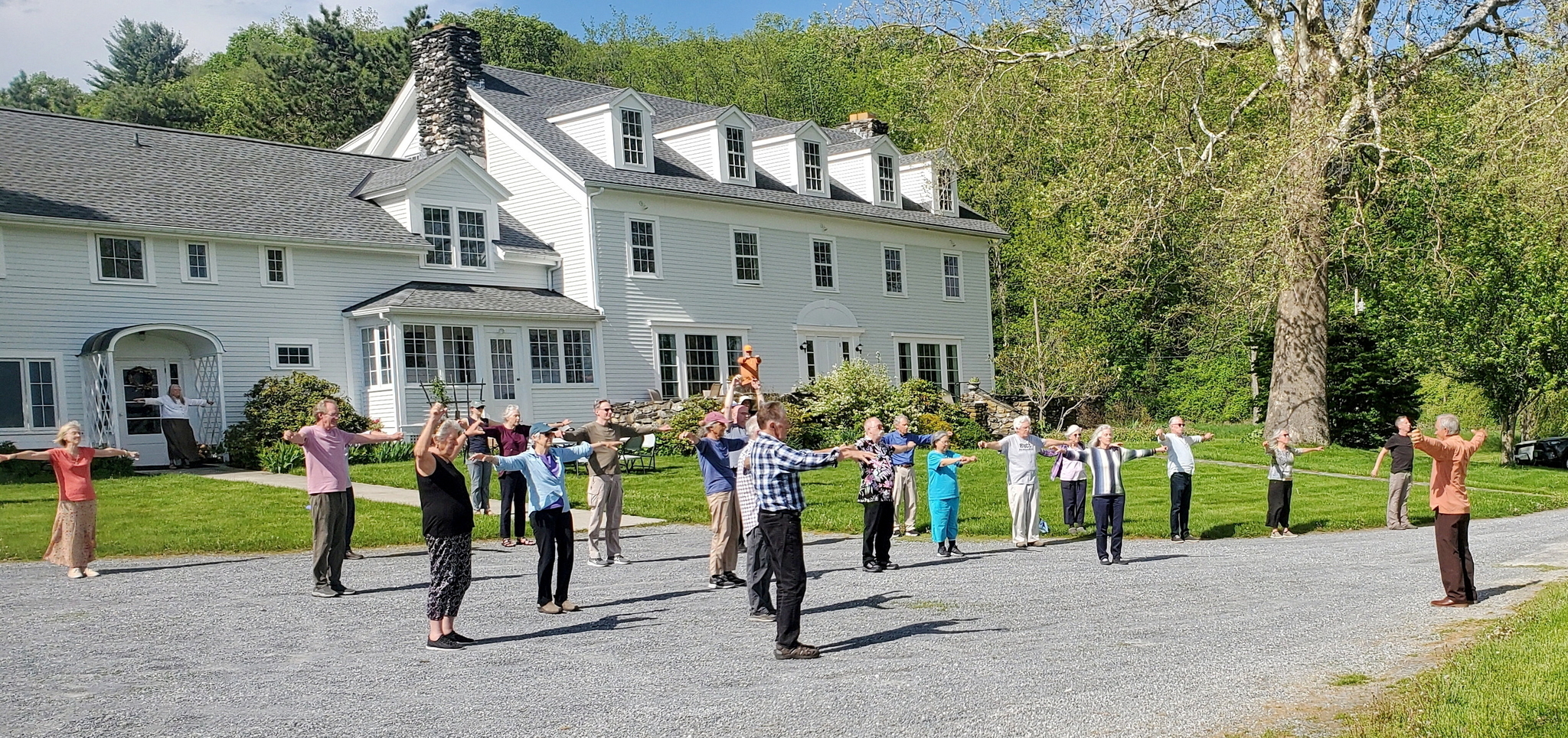 Brother Jitananda conducts the practice of the Energization Exercises before a group meditation.
