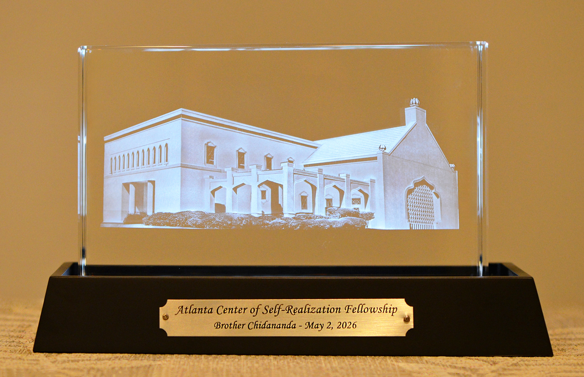 The Atlanta Center presented Brother Chidananda with a gift to commemorate his visit, a holographic representation of the center.