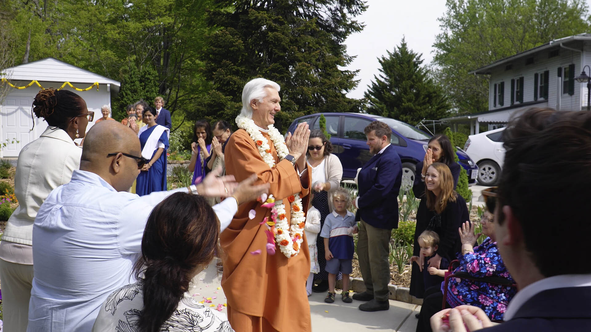 Brother Chidananda is warmly welcomed as he arrives at the SRF Greenfield Ashram Center and Retreat.