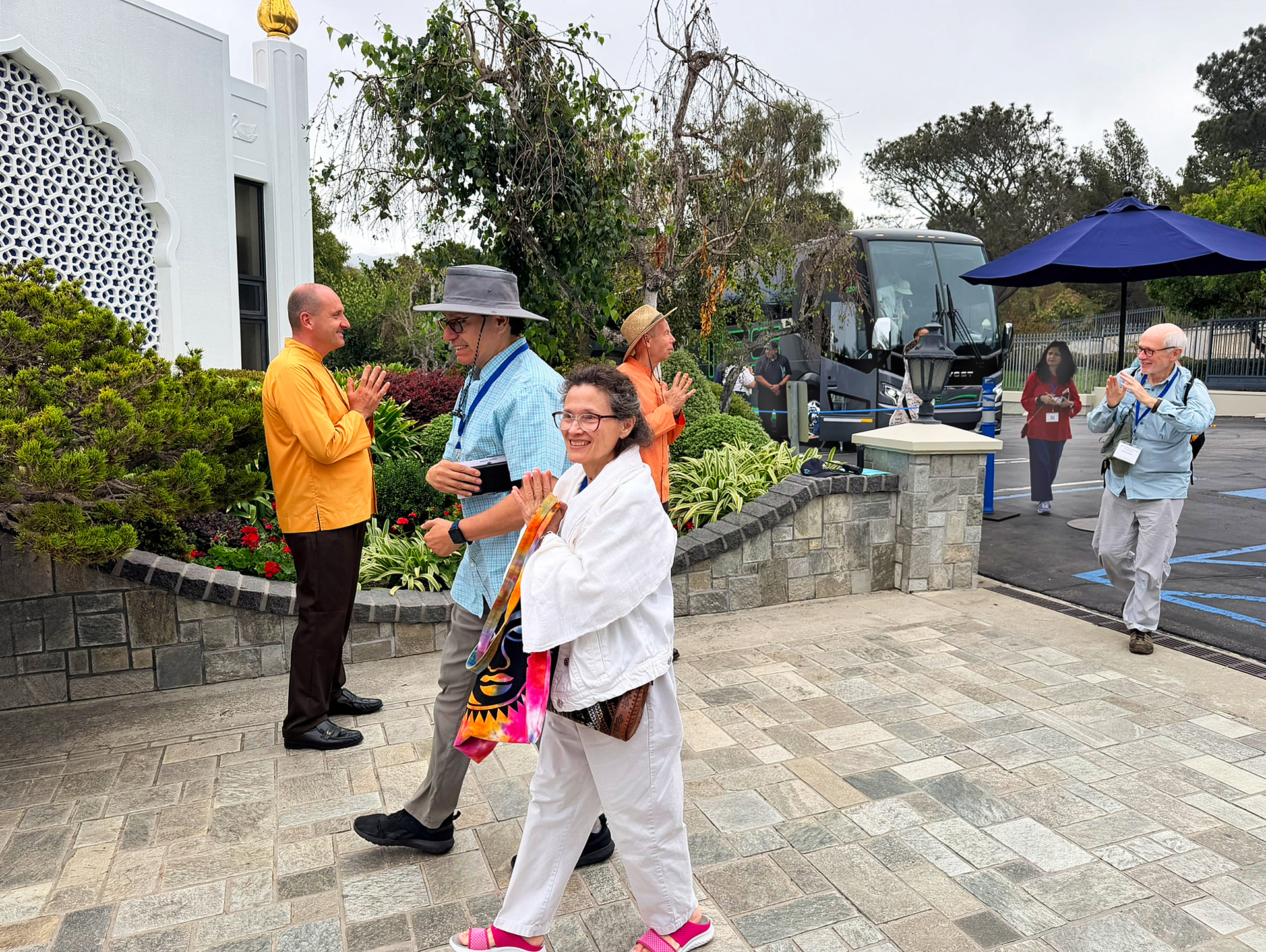 Brother Vidurananda and Brahmachari Giovanni greeting arriving guests.