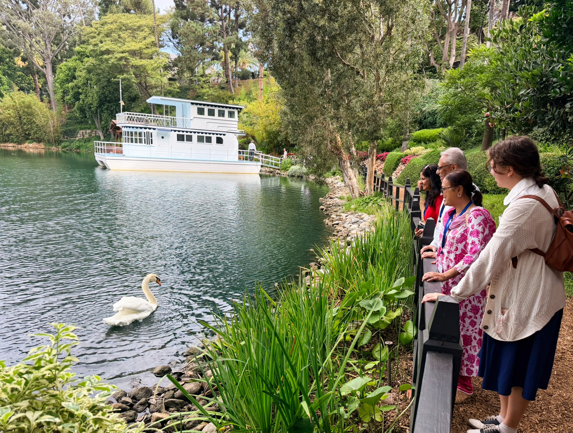 The swans contribute to the atmosphere of tranquility, welcoming guests in their own way.