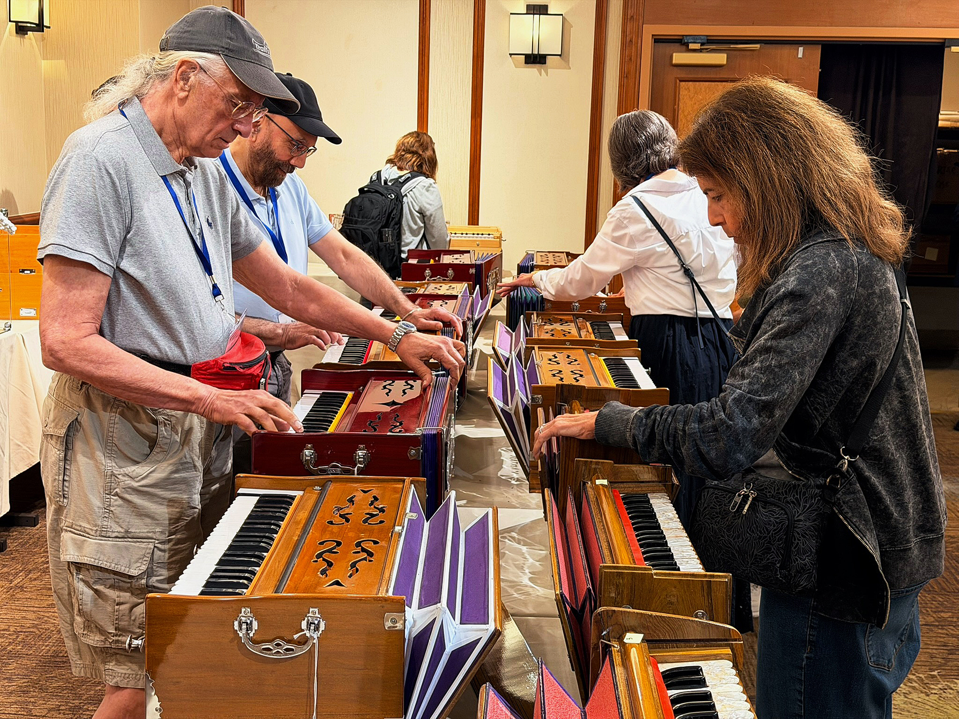 In the Books and Gifts Room, there is interest in the harmoniums on display as helpful aids in devotional chanting.