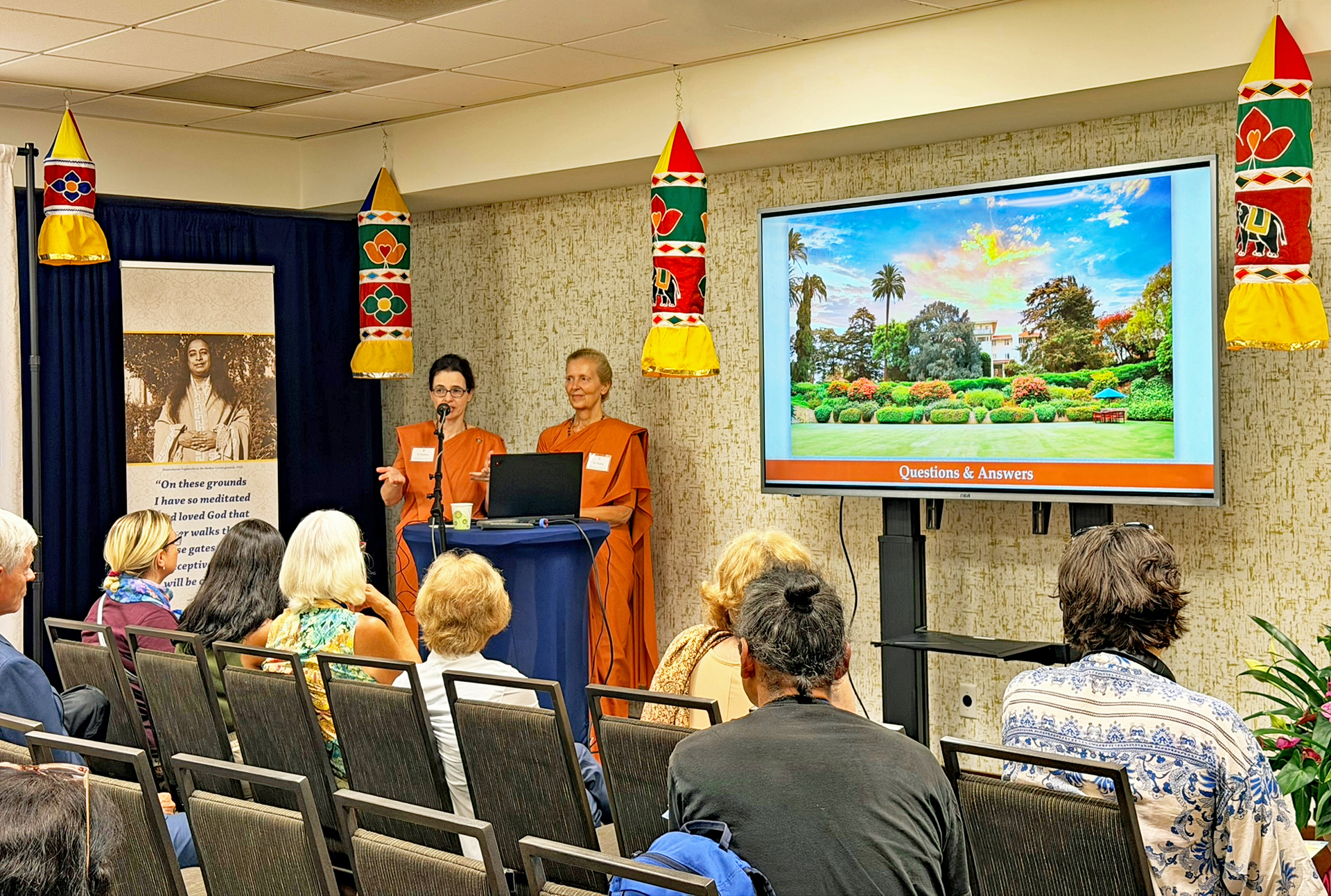 Sister Darshana and Sister Padma present the key points regarding the International Headquarters Retrofit & Rehabilitation Project.