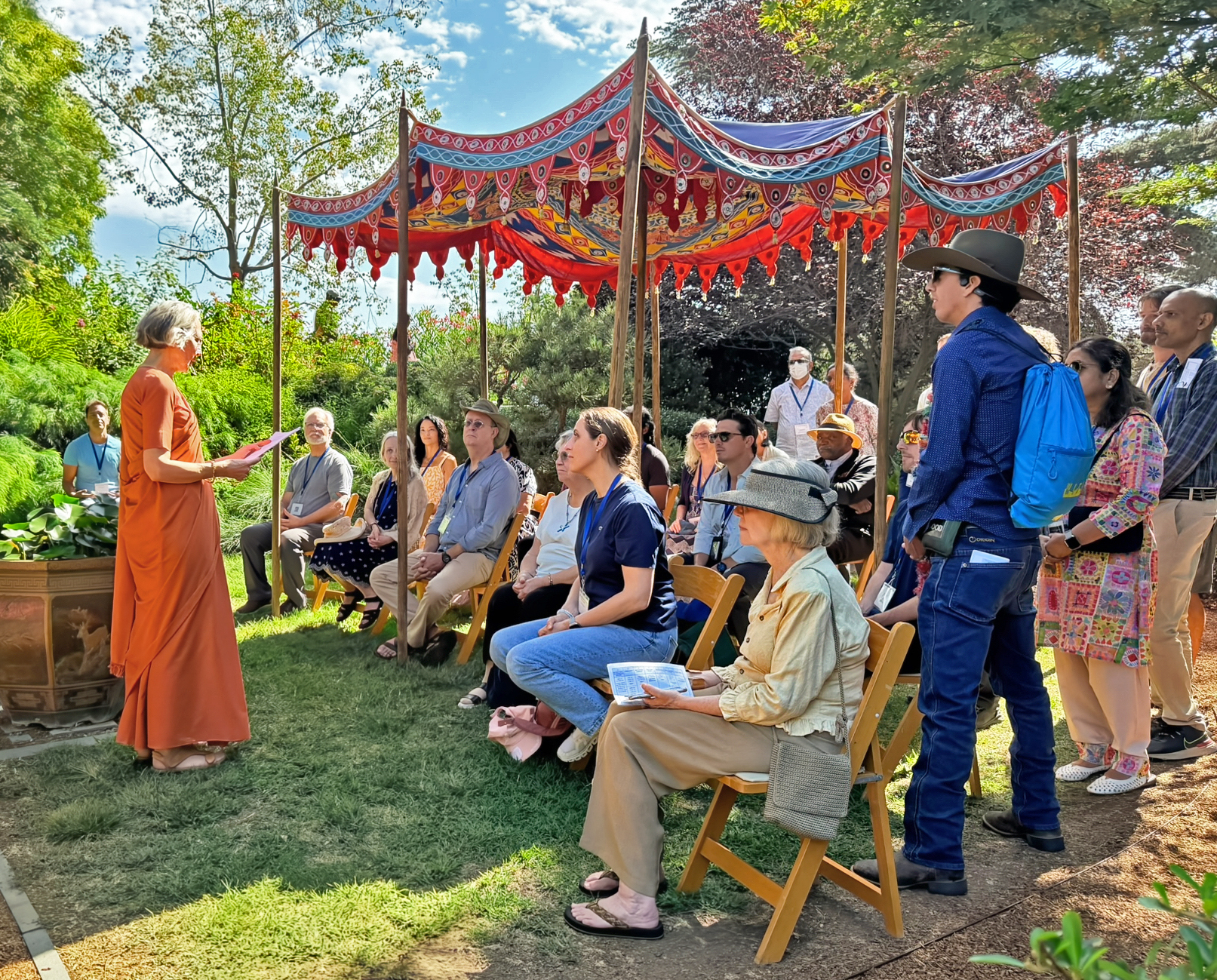 The meditation gardens provide a tranquil environment; here, a nun shares stories of the Master.