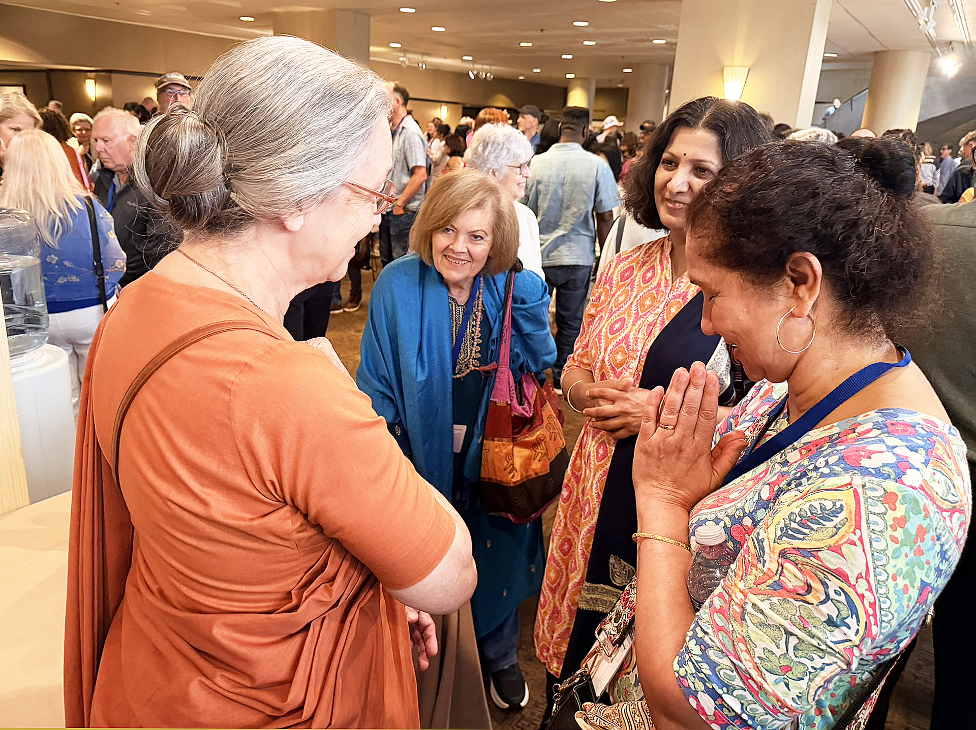 Sister Dhira extends a greeting to attendees coming from around the world.