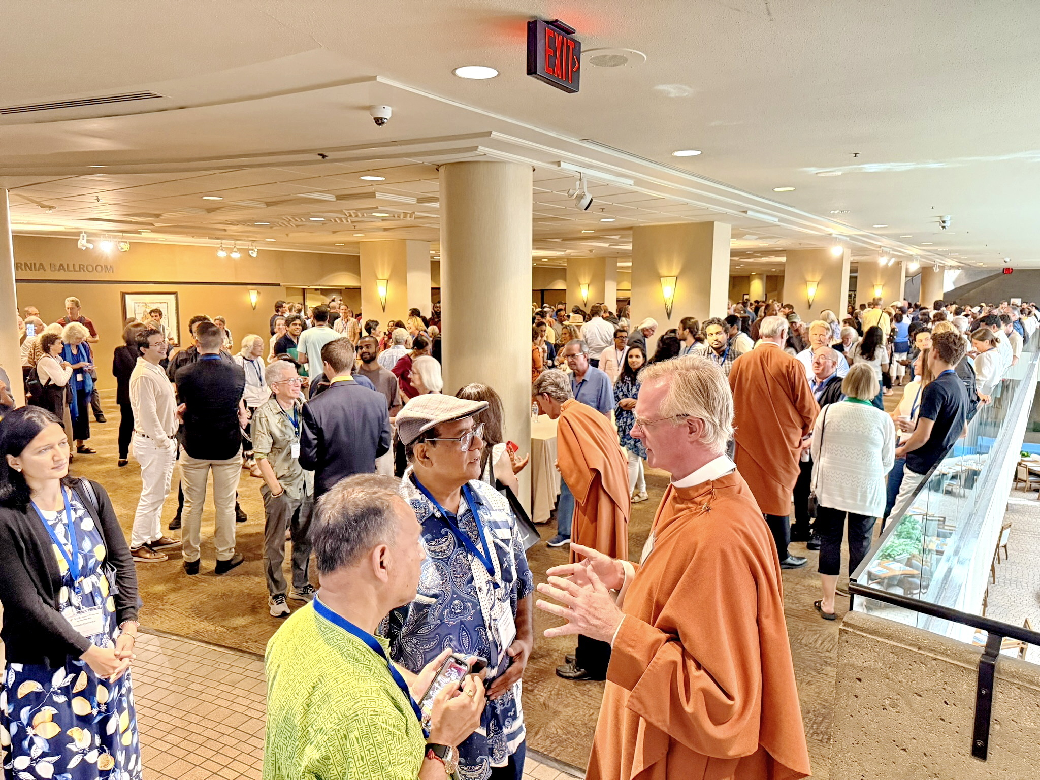 SRF monks and nuns extend a warm greeting to participants at one of Convocation's Open House gatherings.