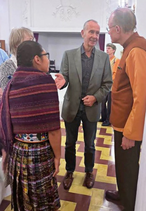 Brother Prafullananda greets devotees after the program.