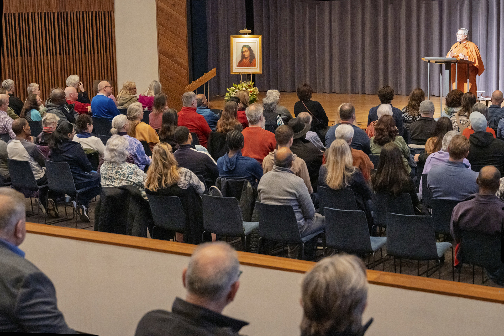 Brother Saralananda speaks on Paramahansaji's teachings to a full audience during a public lecture in Kansas City.