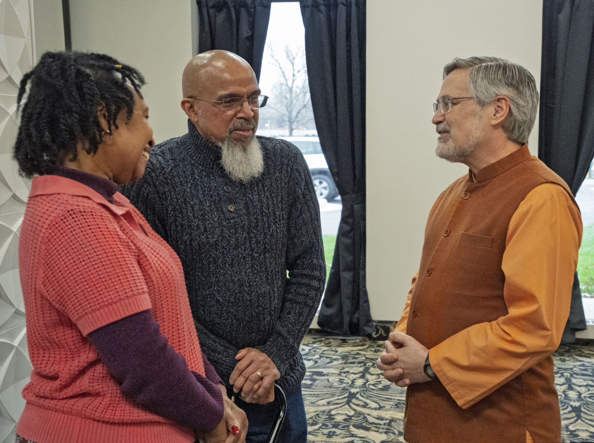 Brother Saralananda greets attendees at the Kansas City Meditation Group's meeting place. The monks conducted classes and meditations throughout the weekend.