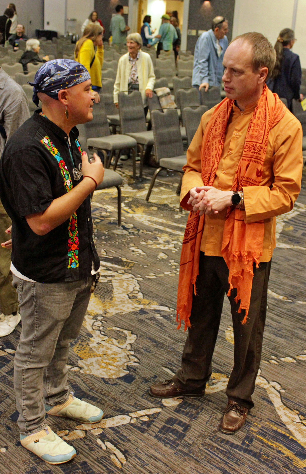 ...and Brother Dhyanananda greets a participant.