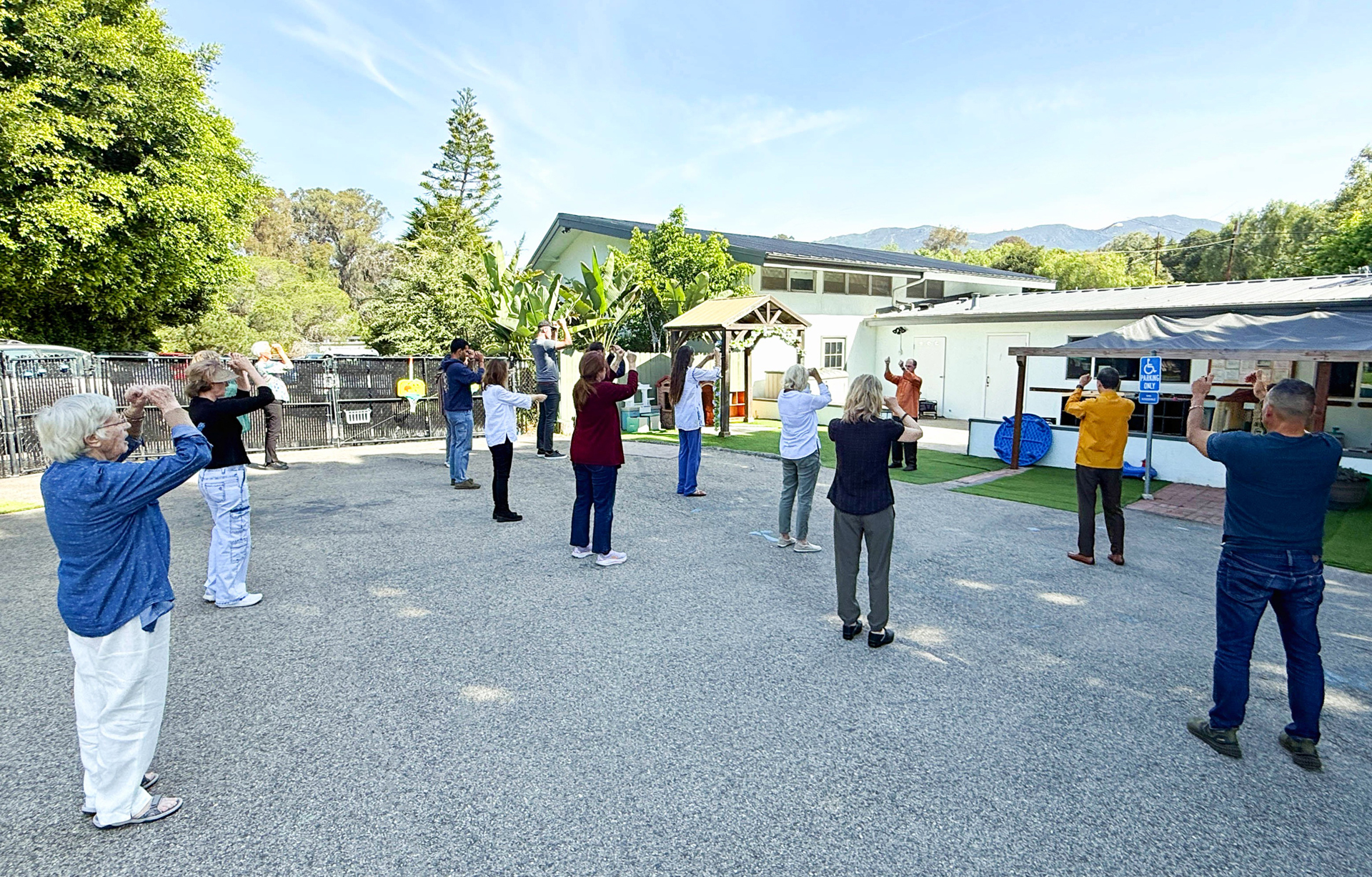 The monks gave classes on Paramahansaji's "how-to-live" teachings. Here, Brother Bhimananda conducts the practice of Paramahansaji's Energization Exercises before a group meditation.