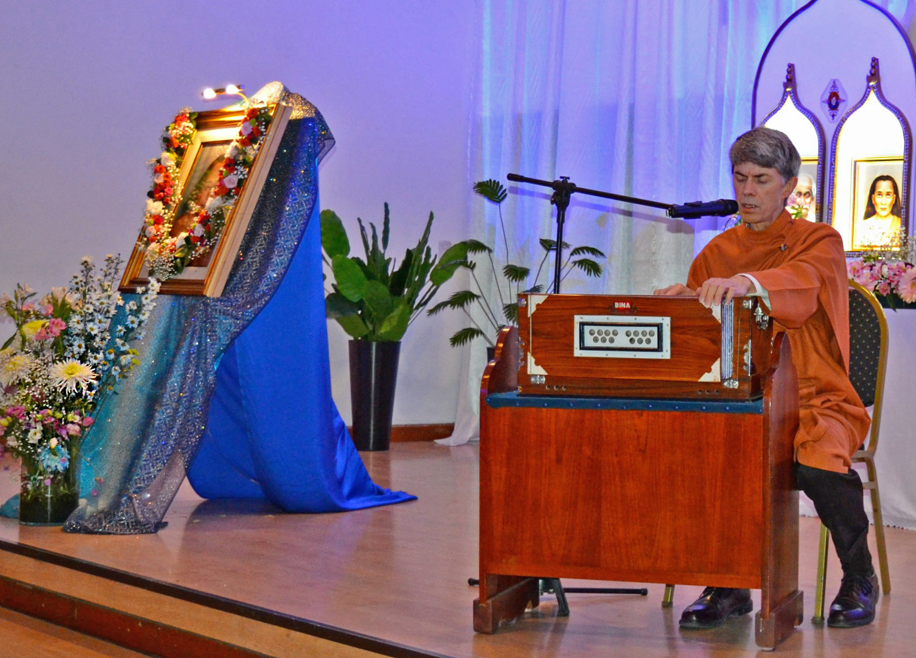 ...and conducts a meditation with devotional chanting.