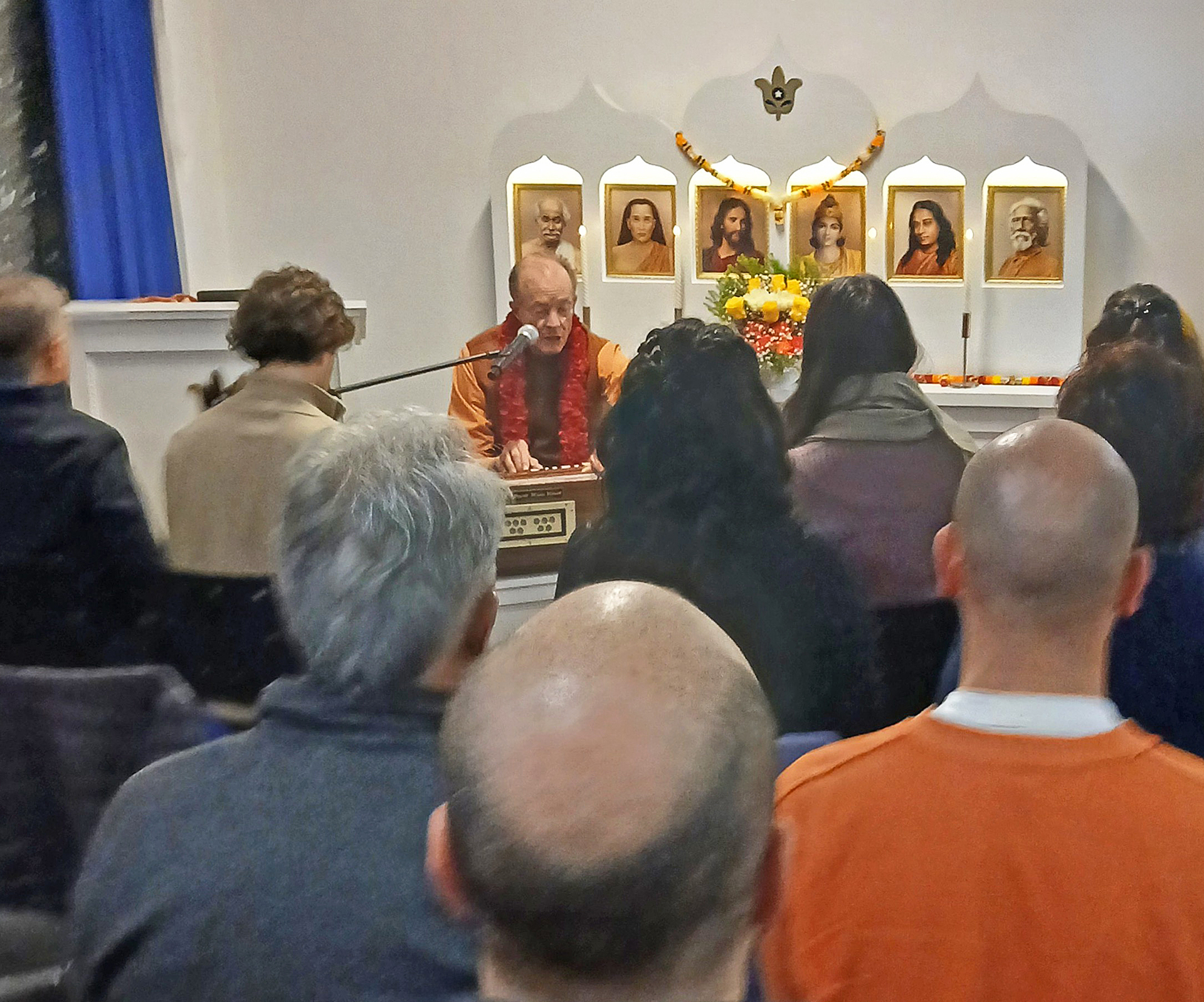 ...and Brother Prafullananda leads a devotional chant at the start of a meditation.
