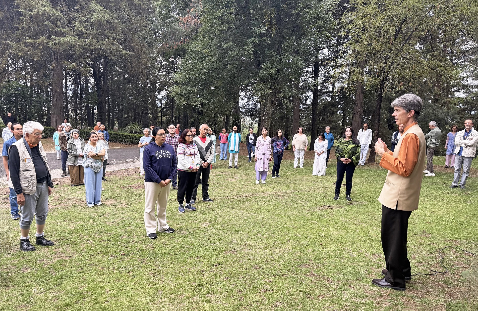 ...and conducts a review of Paramahansaji's Energization Exercises prior to a group meditation.