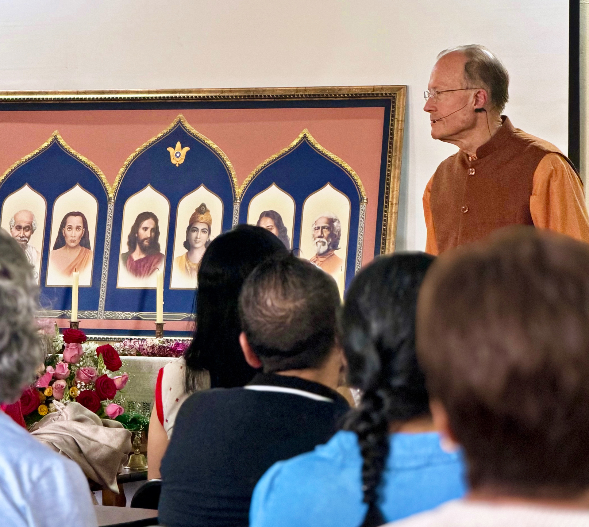 ...and gives an inspirational talk on Paramahansaji's teachings.