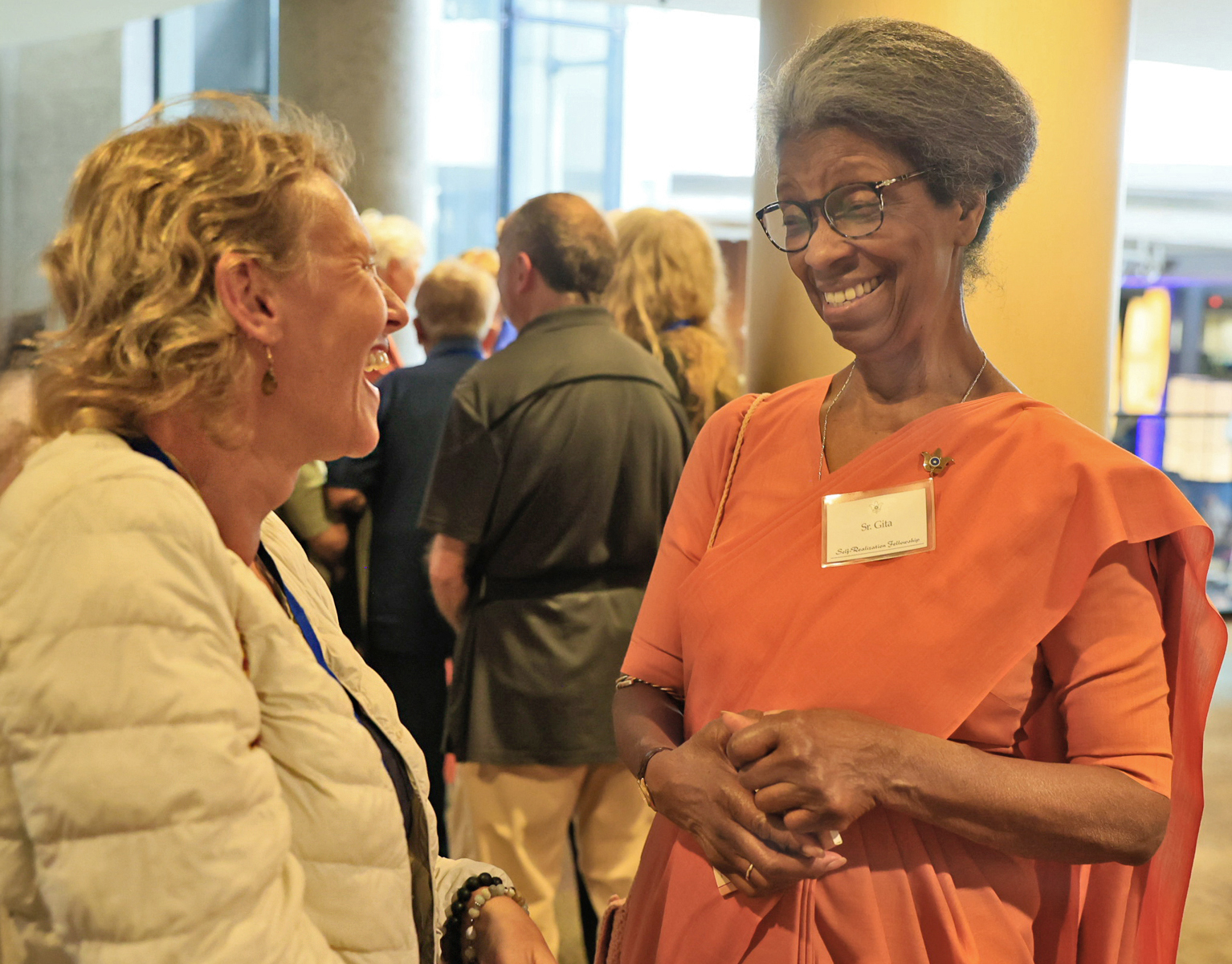 Sister Gita welcoming a member.