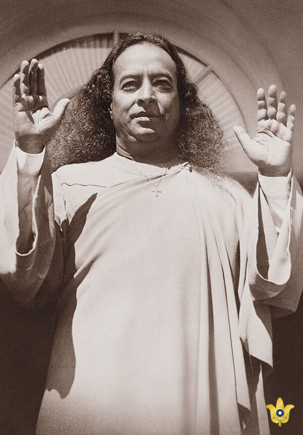 Yogananda with hands up in garmentsd sepia 600x860