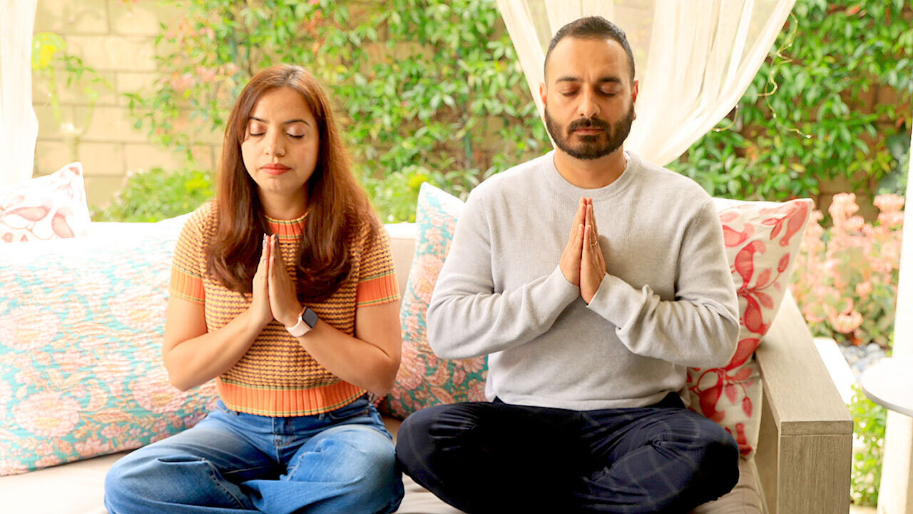 SRF Devotee Couple praying 16x9
