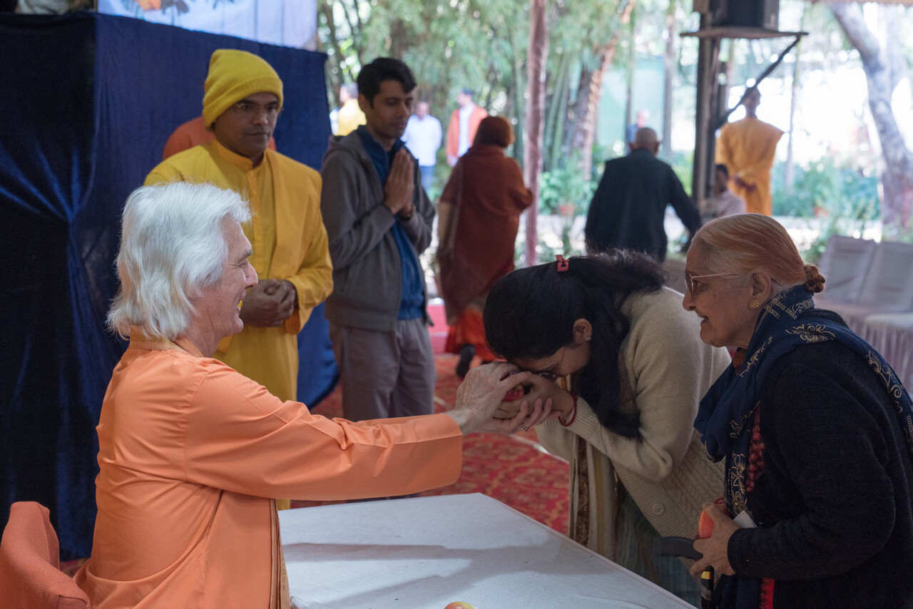 YSS devotees receive prasad from Brother Chidananda