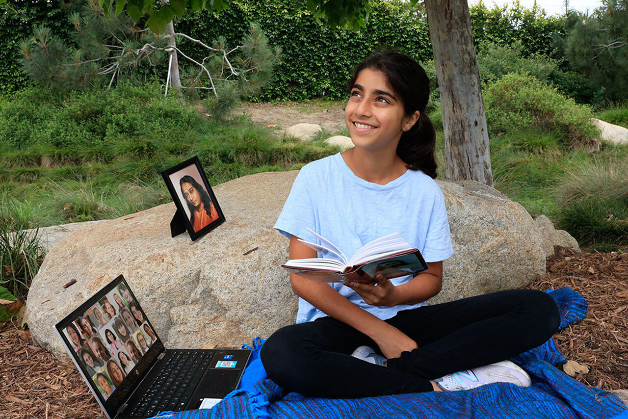 Youth girl studying with online devotees