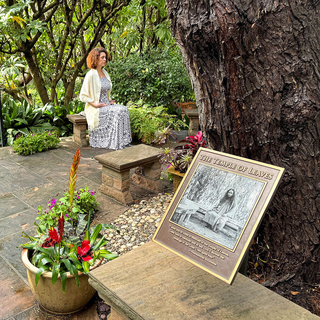 Devotee praying at temple of leaves