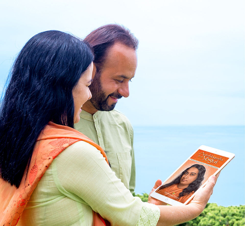 Devotees looking at tablet ocean view cliff 2